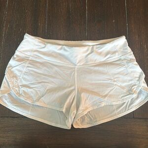 White Lululemon running shorts, size 6. 2.5” inseam